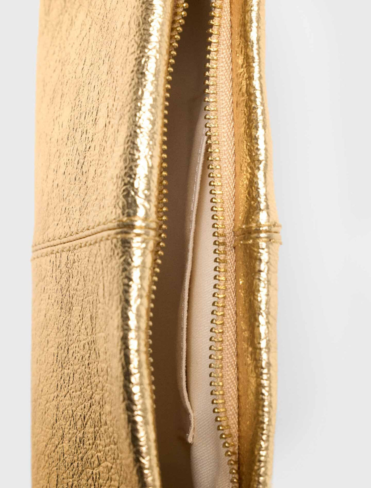 Miss M Metallic Pouch Bag | Maje